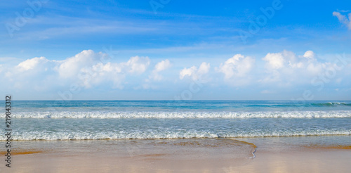 Deserted sandy beach of the Indian Ocean and blue sky, Wide photo.