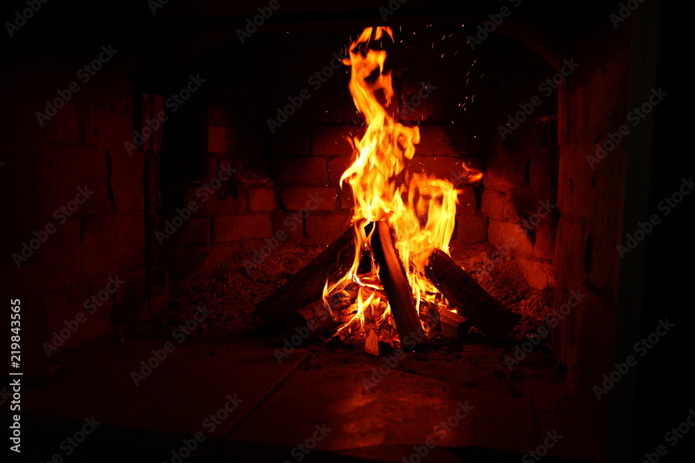 fire in a brick fireplace/ fire in a brick fireplace, flames are inflaming