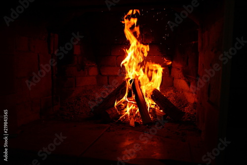 fire in a brick fireplace/ fire in a brick fireplace, flames are inflaming