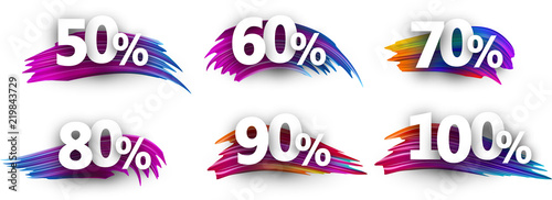 Discount tags with percent and colorful brush strokes.