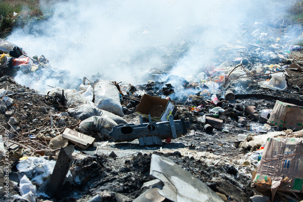 Burning pile of garbage, cause of air pollution. Pollution concept