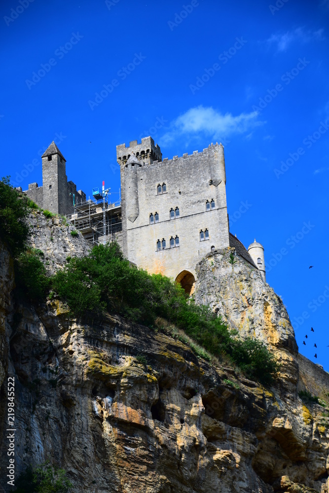 The medieval fortress of Beynac as seen from the Dordogne River in Aquitaine. France