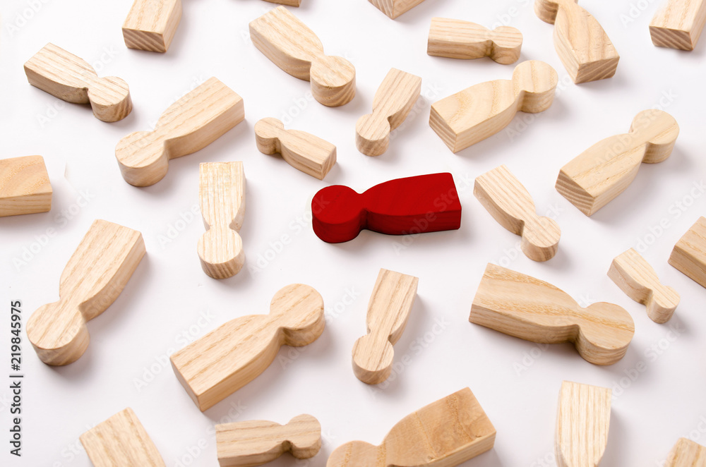 Wooden figures of people are lying on a white background. The concept of human resources management. Headhunters. Search for people to work. The search for the second half. Social network. Business Wooden figures of people are lying on a white background. The concept of human resources management. Headhunters. Search for people to work. The search for the second half. Social network. Business