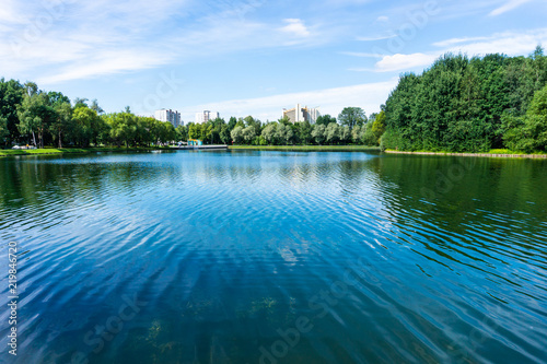 Park with pond in big city at sunny day. park in Moscow  Russia