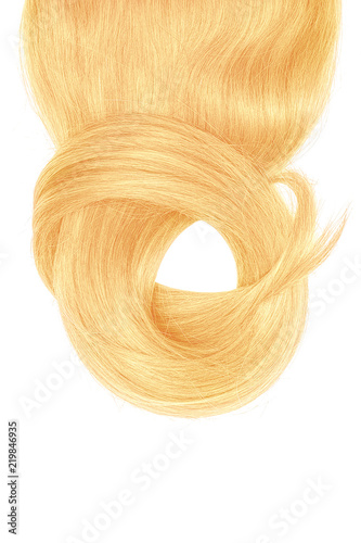Blond hair isolated on white background. Long beautiful ponytail in shape of circle