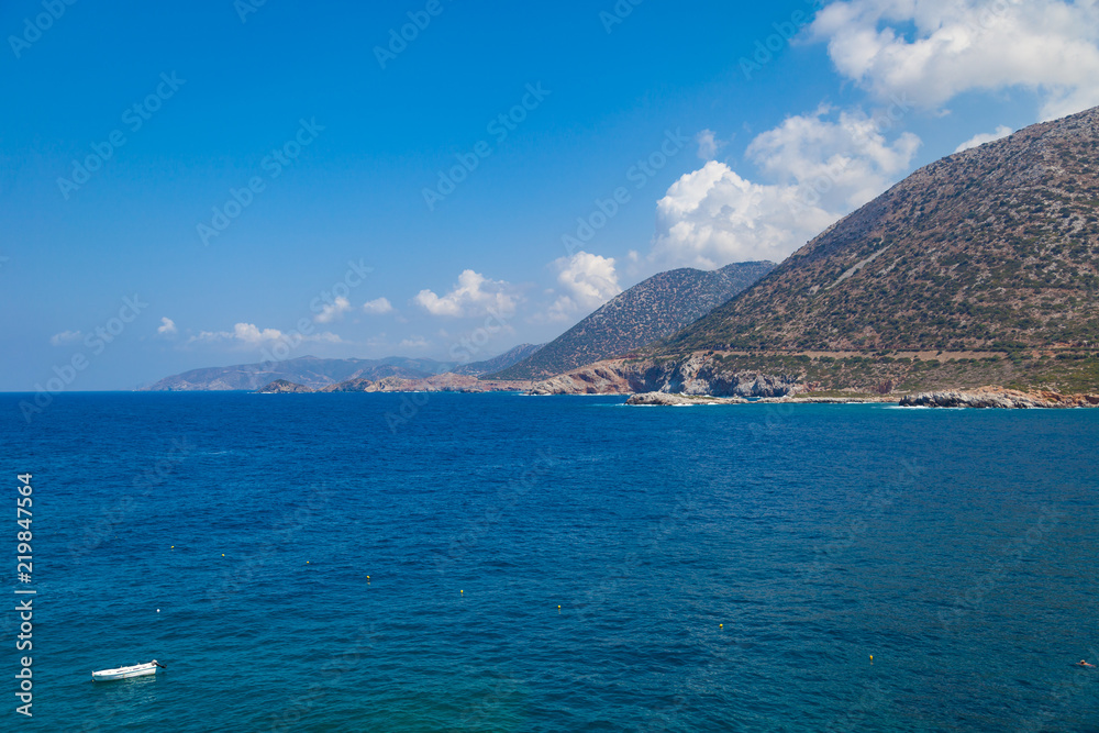 Crete island mountain rocky shores. View from Karavostasi beach, Crete, Greece.