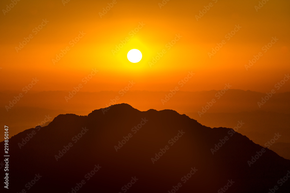 Landscape with orange sunset in Egypt mountain desert, Mount Sinai