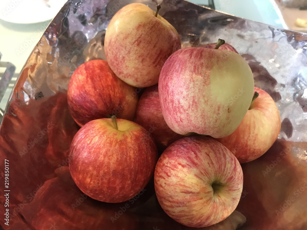 fresh raw red apples fruit stack piling in decorative stainless metal tray. Food, Natural Nutrition, Health care concept. fresh raw red apples fruit stack piling in decorative stainless metal tray. Food, Natural Nutrition, Health care concept.