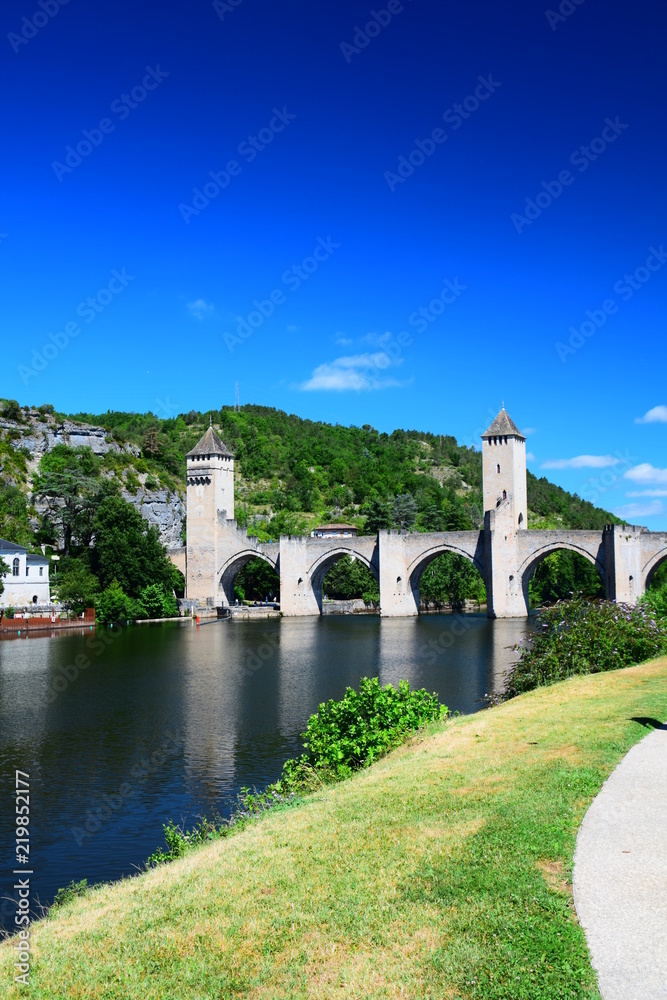 The medieval Pont Valentre crossing the Lot River in Cahors, France The medieval Pont Valentre crossing the Lot River in Cahors, France