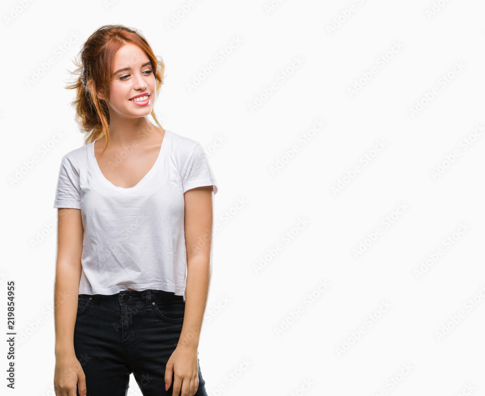 Young beautiful woman over isolated background looking away to side with smile on face, natural expression. Laughing confident. Young beautiful woman over isolated background looking away to side with smile on face, natural expression. Laughing confident.