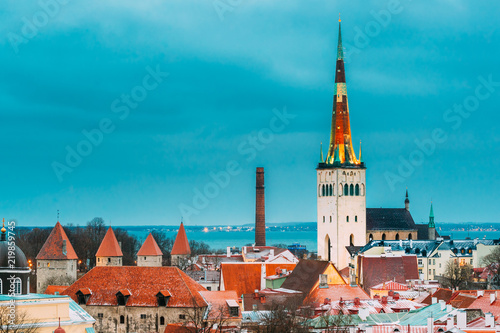 Tallinn, Estonia. Tallinn City Wall With Towers, Tower Of Church photo