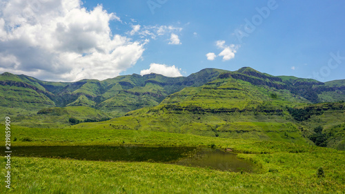 Rich nature with grass and mountains, clouds, in Drakensberg Giant Castle, South Africa 