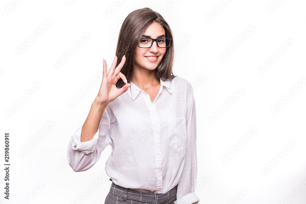 Business woman with an ok sign isolated over a white background Business woman with an ok sign isolated over a white background