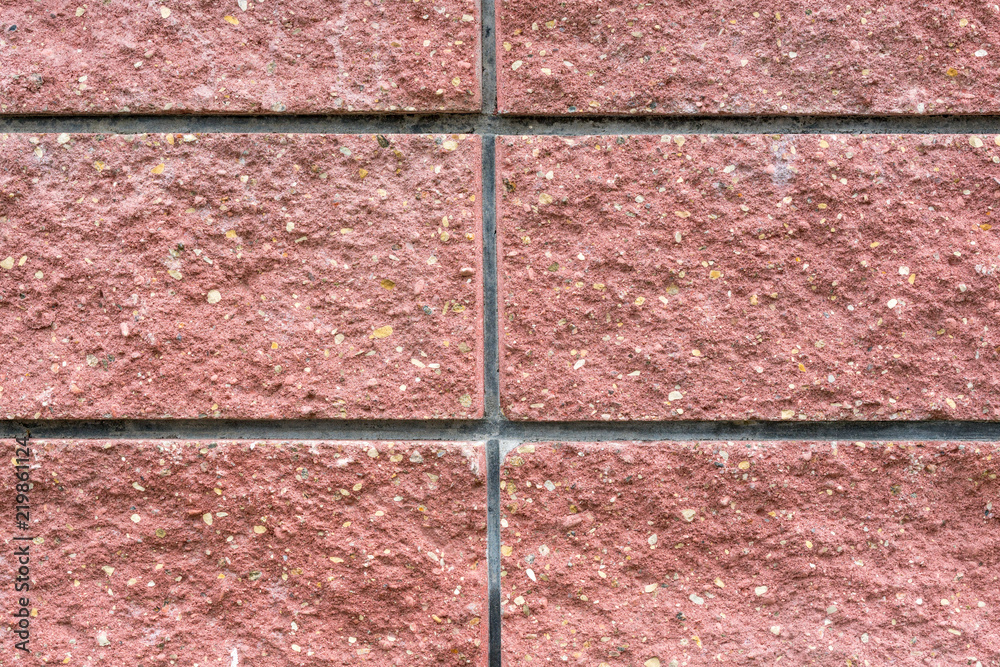Fototapeta premium fragment of a wall from large pink blocks