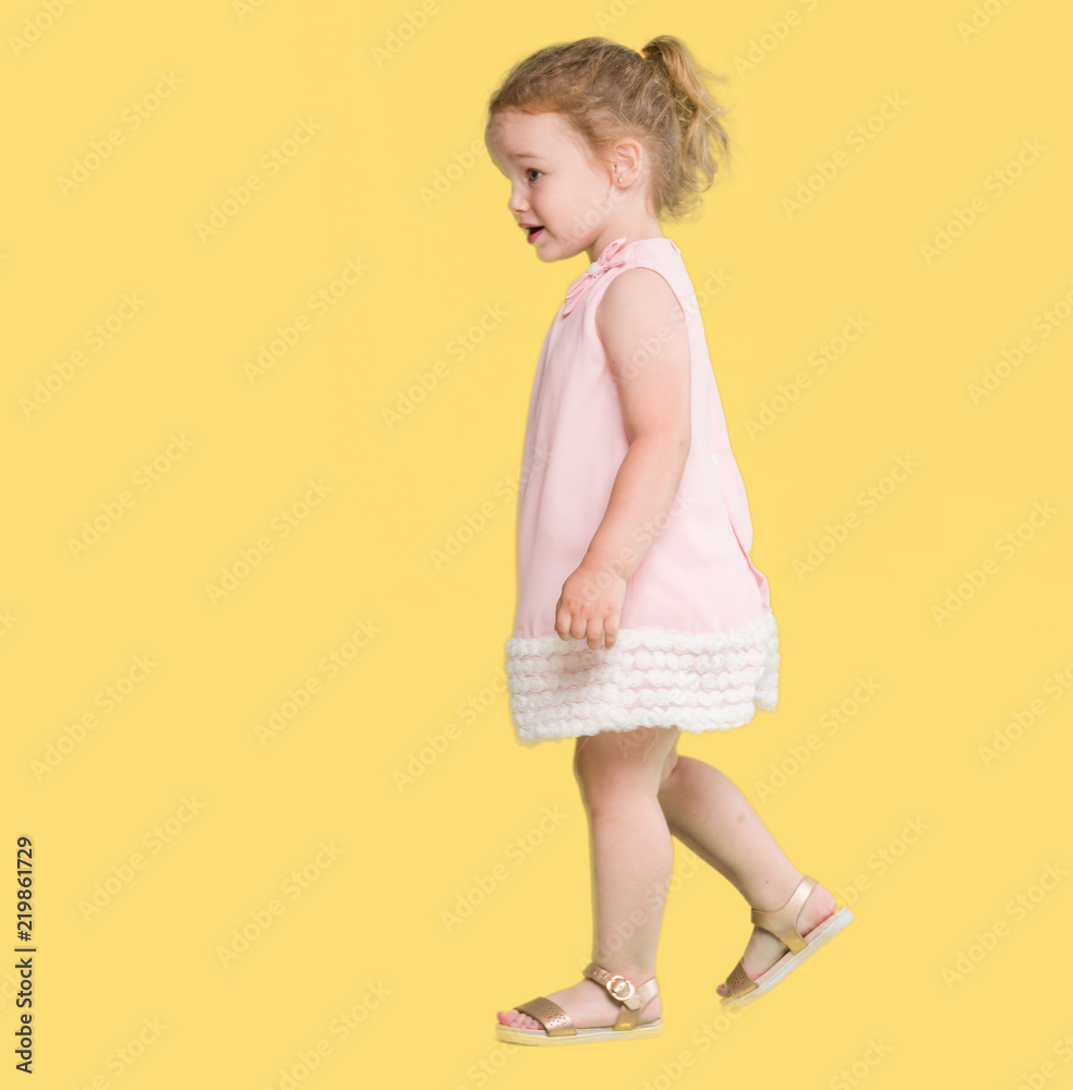 Beautiful blonde toddler gesturing