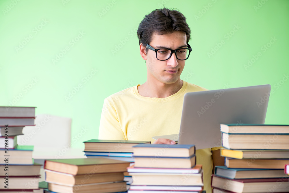 Student with too many books to read before exam Student with too many books to read before exam