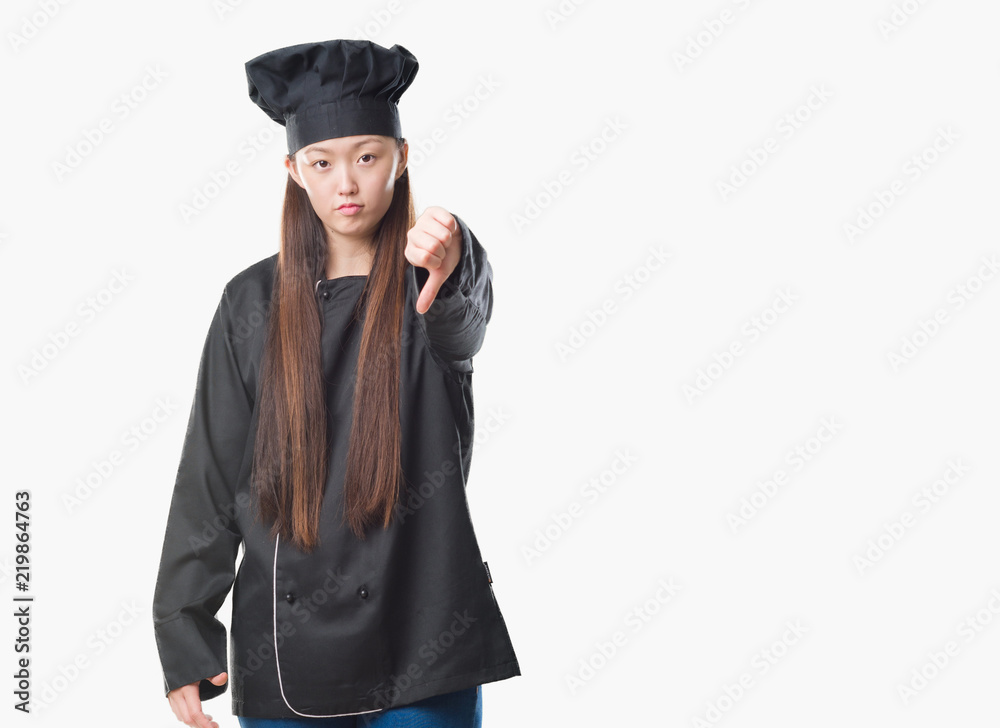 Young Chinese woman over isolated background wearing chef uniform looking unhappy and angry showing rejection and negative with thumbs down gesture. Bad expression. Young Chinese woman over isolated background wearing chef uniform looking unhappy and angry showing rejection and negative with thumbs down gesture. Bad expression.