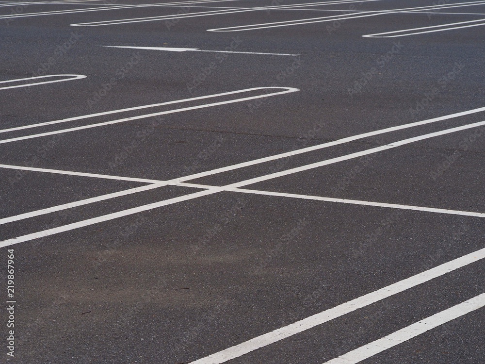 asphalt surface of car parking slot with white line stripe