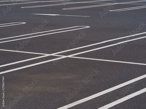 asphalt surface of car parking slot with white line stripe
