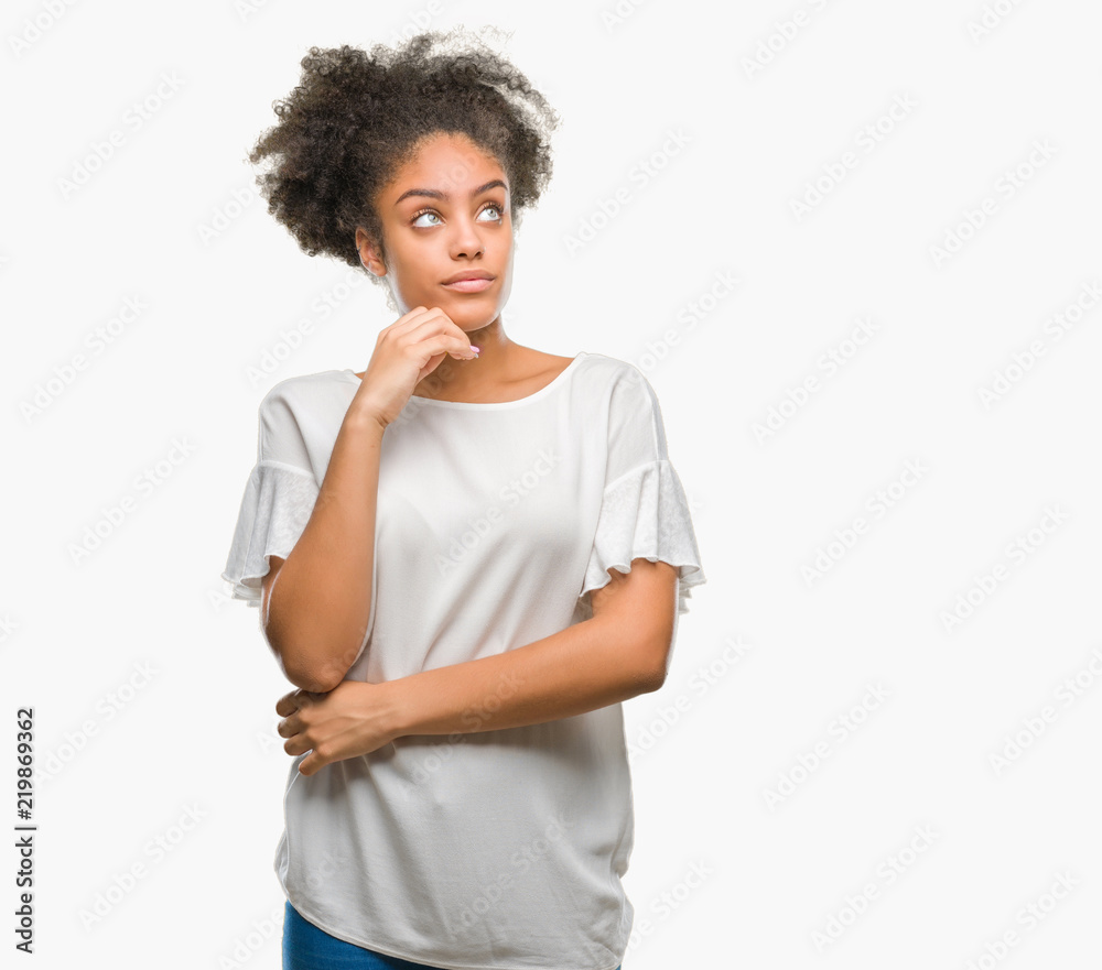 Young afro american woman over isolated background with hand on chin thinking about question, pensive expression. Smiling with thoughtful face. Doubt concept. Young afro american woman over isolated background with hand on chin thinking about question, pensive expression. Smiling with thoughtful face. Doubt concept.