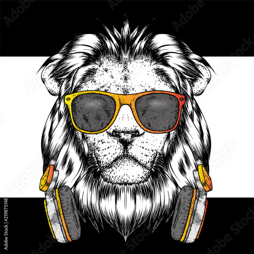 Fototapeta Naklejka Na Ścianę i Meble -  A beautiful lion wearing headphones and glasses. Vector illustration for a postcard or a poster, print for clothes. I love music.