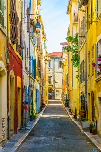 Fototapeta Naklejka Na Ścianę i Meble -  A narrow street in the Le Panier district of Marseille, France