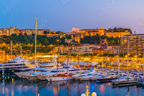 Old town of Monaco overlooking port Hercule during sunset photo