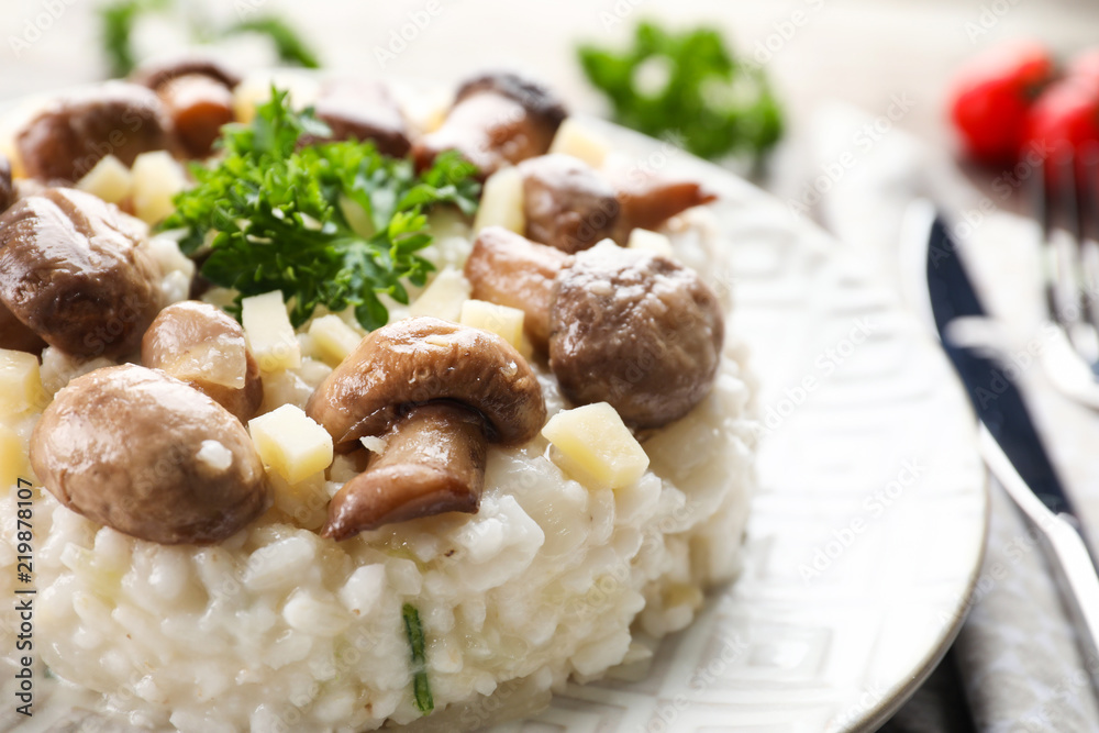 Tasty risotto with mushrooms on plate, closeup Tasty risotto with mushrooms on plate, closeup