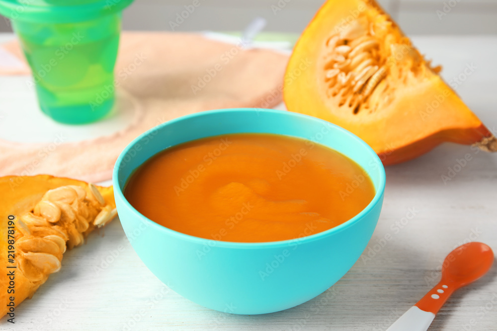 Bowl of healthy baby food on light table Bowl of healthy baby food on light table