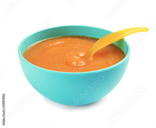 Bowl of healthy baby food on white background