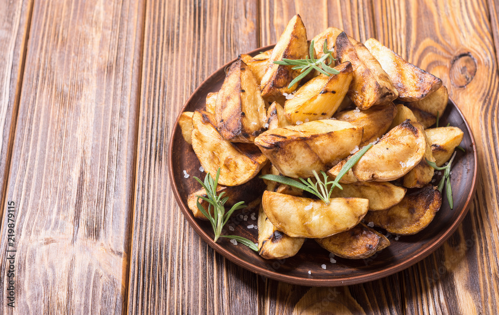 Homemade grilled potatoes with rosemary Homemade grilled potatoes with rosemary