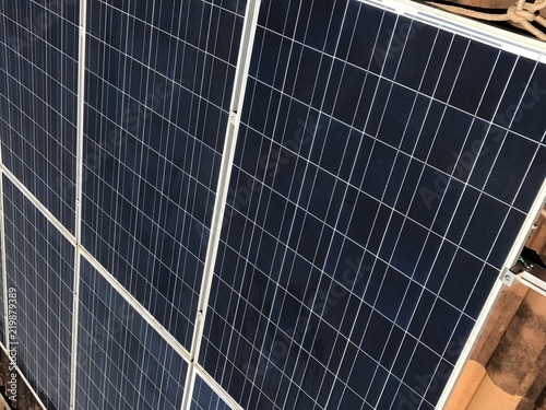 Obraz na plátně Close-up of Solar energy panel photovoltaics module in top of a house