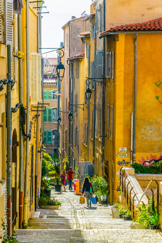 Fototapeta Naklejka Na Ścianę i Meble -  A narrow street in the Le Panier district of Marseille, France