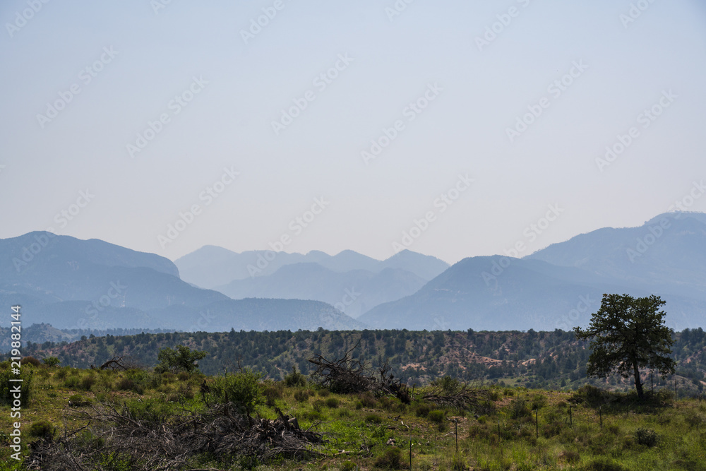 A hazy view of a distant New Mexico mountain range.
