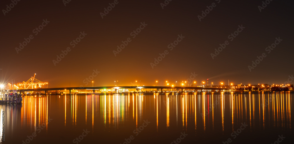 Tauranga Harbour Bridge and surrounds illuminates night sky and harbour