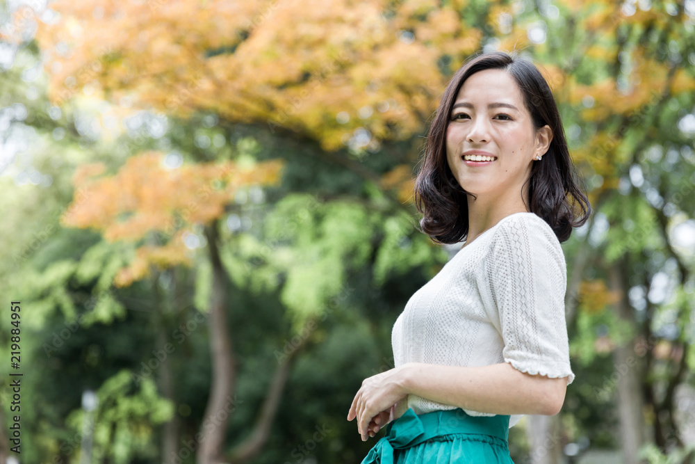 attractive asian woman relaxing in park attractive asian woman relaxing in park