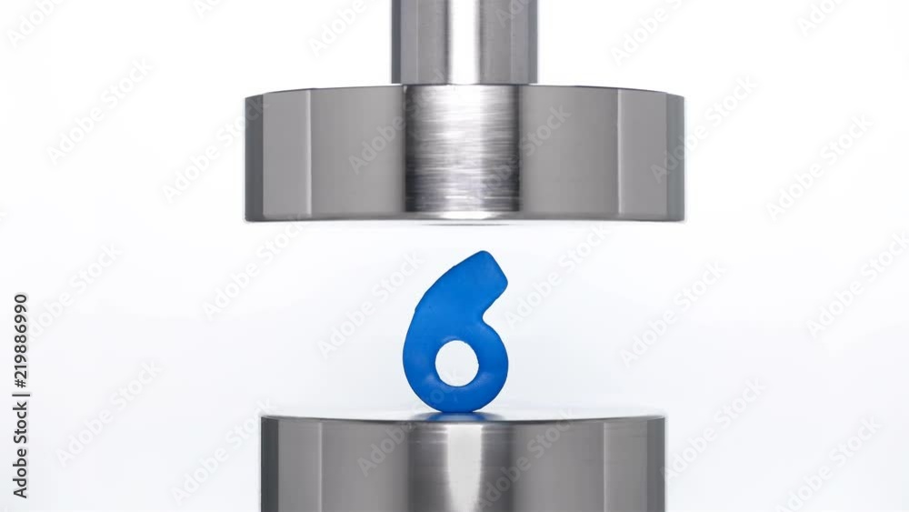 the appearance of the number six when lifting the rod from a hydraulic press on a white background, close-up the appearance of the number six when lifting the rod from a hydraulic press on a white background, close-up