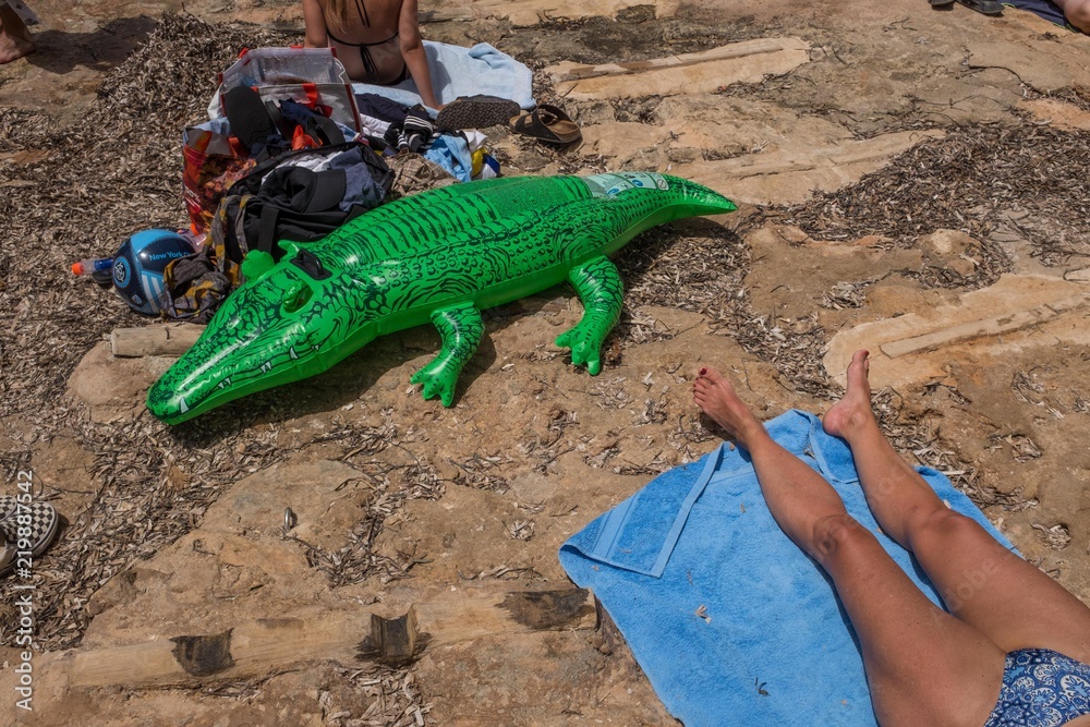 Inflatable alligator on beach in Mallorca, Spain Inflatable alligator on beach in Mallorca, Spain