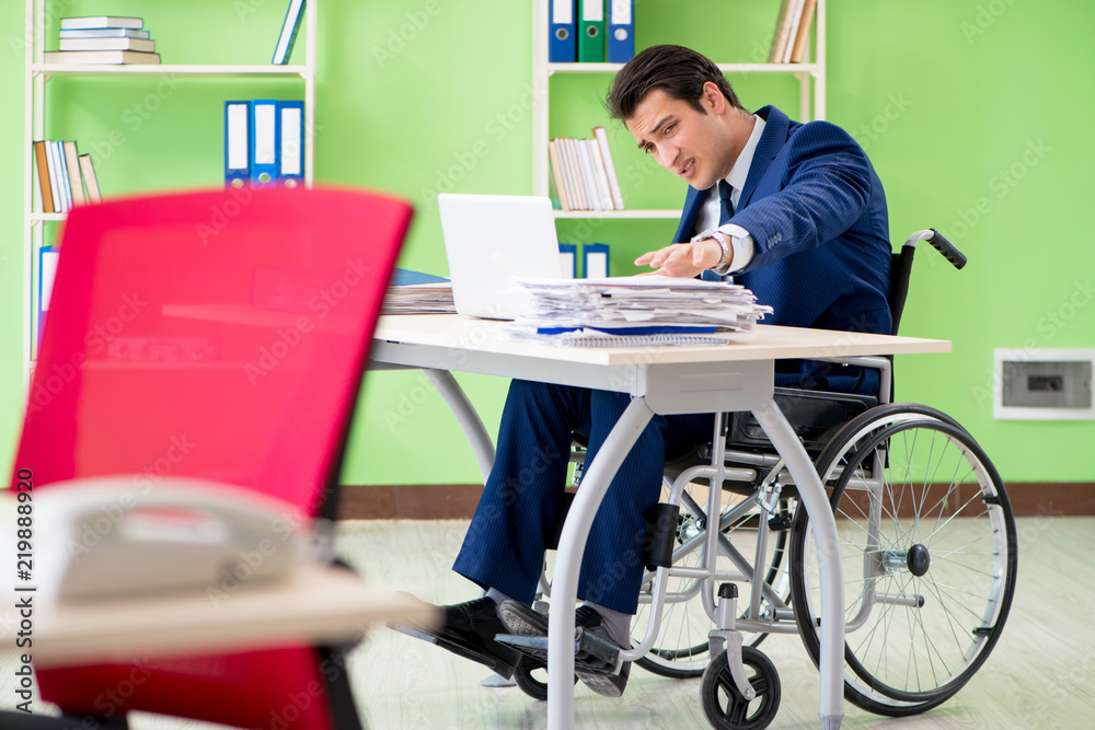 Disabled businessman working in the office Disabled businessman working in the office