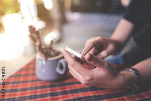 Woman working using smart phone. Business concept selective focus vintage color.