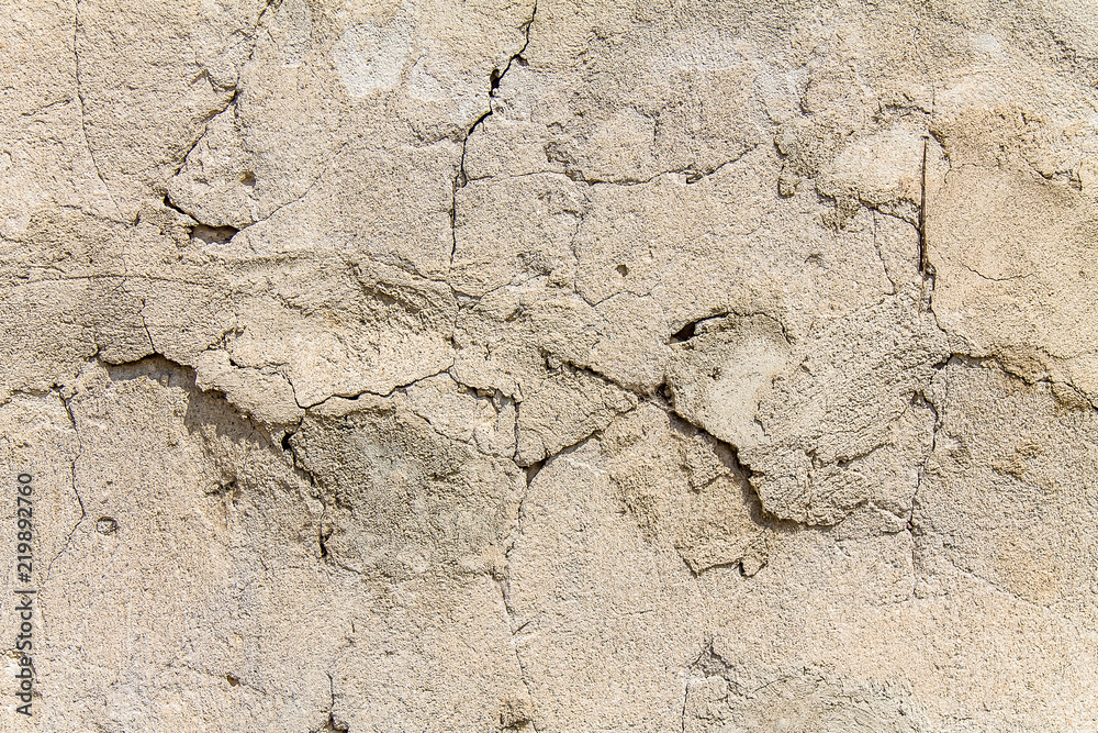 Old plastered wall as an abstract background for design Old plastered wall as an abstract background for design