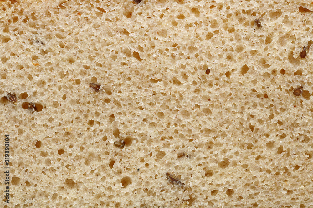 Macro texture of rustic simple rye bread with cumin seeds Macro texture of rustic simple rye bread with cumin seeds