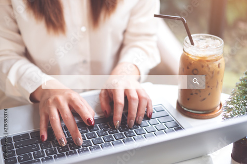 Searching and browsing concept. Woman using laptop to searching information on internet. soft focus, vintage tone.