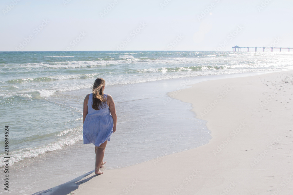 Girl Walking Towards Sunset