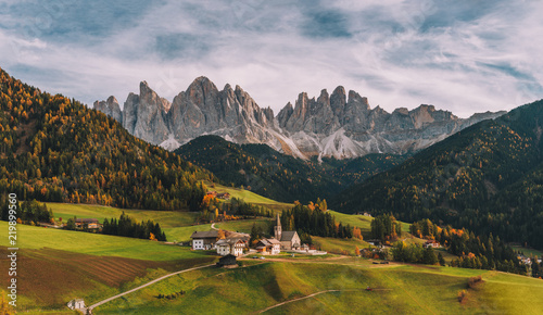 Santa Maddalena (St Magdalena) village with magical Dolomites mountains in background, Val di Funes valley, Trentino Alto Adige region, Italy, Europe photo