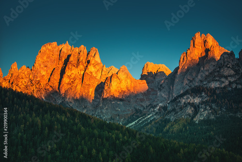 Panoramic view of famous Dolomites mountain peaks glowing in beautiful golden morning light at sunrise in autumn, South Tyrol, Italy