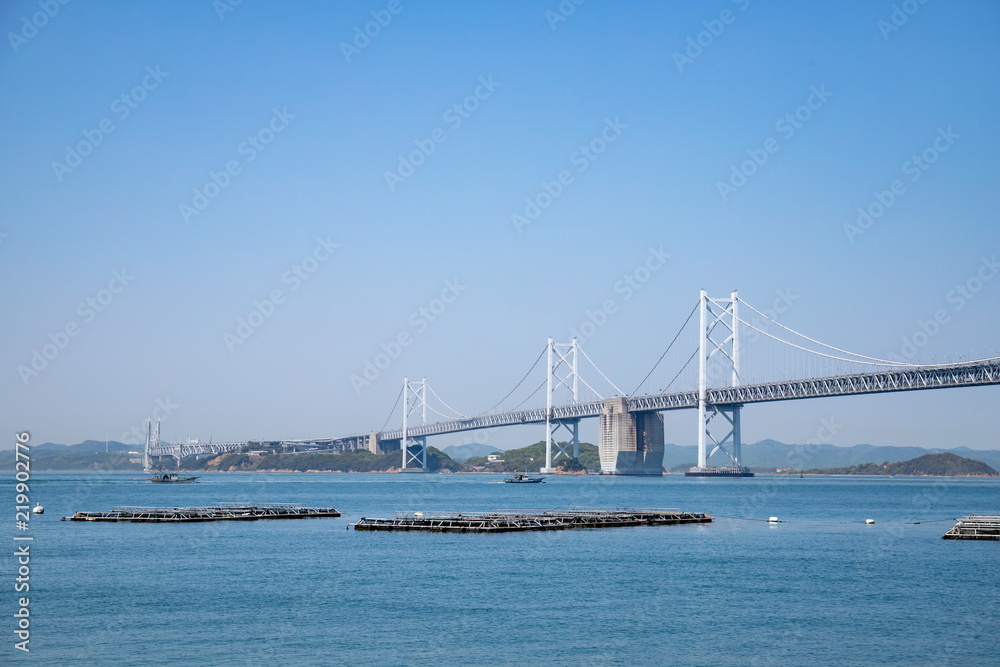 Seto Ohashi Bridge and Aquaculture rafts in seto inland sea,shikoku,japan