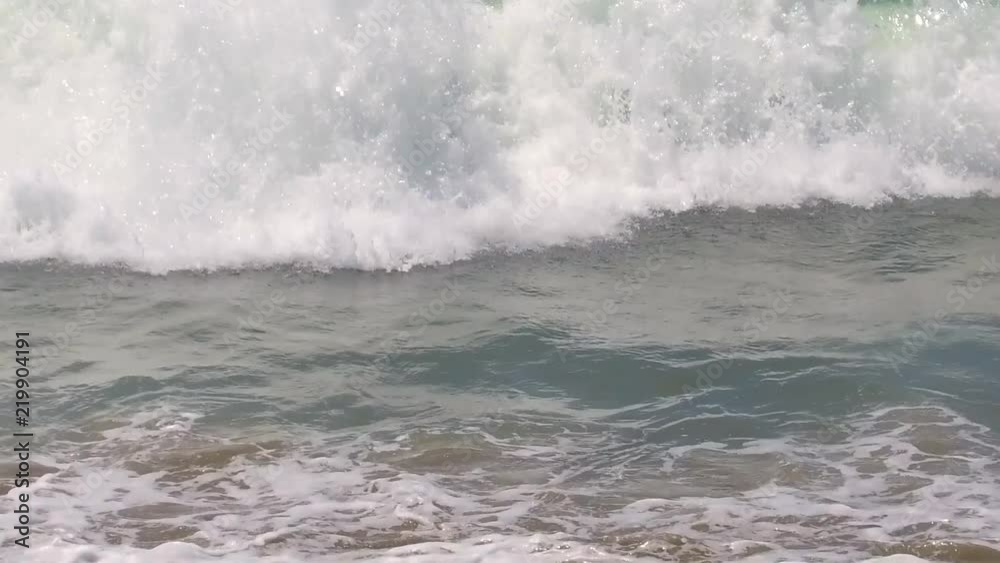 Slow motion waves crashing on a sunny summer day in Santa Monica, CA Slow motion waves crashing on a sunny summer day in Santa Monica, CA