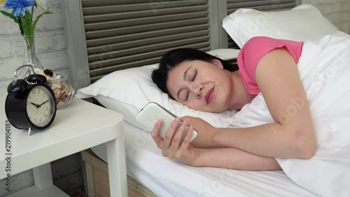 woman lying in bed received some clueless message
