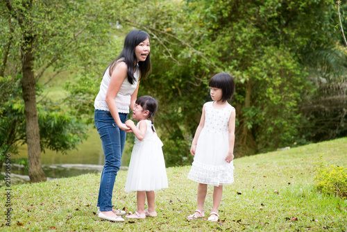 Mother comforting crying daughter